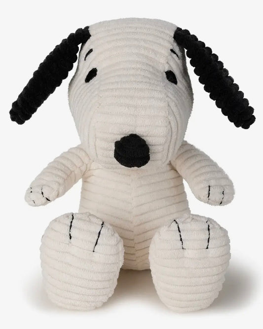 White plush Snoopy toy with black accents on a white background
