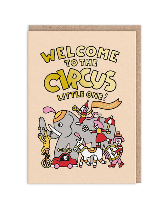 Greeting card with circus-themed illustration and text 'Welcome to the Circus Little One!' on a beige background.