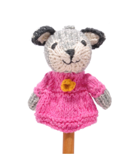 Knitted wolf finger puppet toy with a pink dress, on a white background
