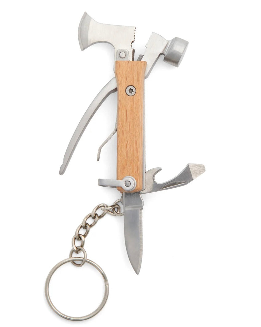 Multitool keychain with axe, hammer, and knife on a white background