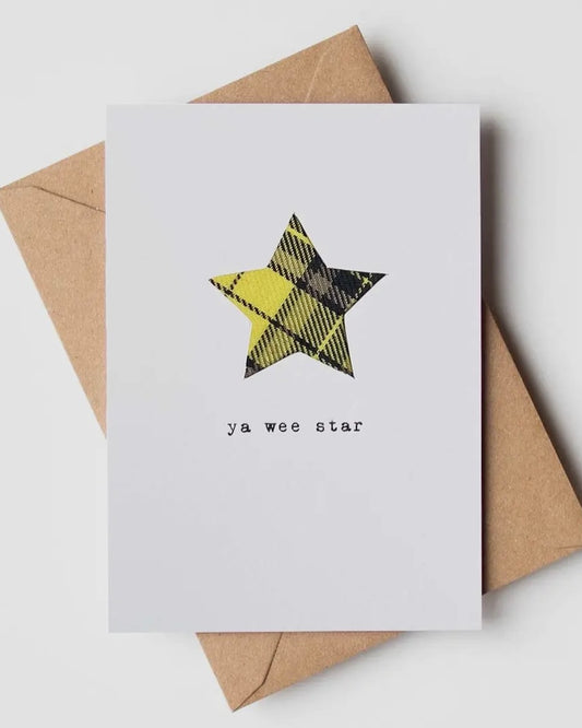 White card with real tartan star shape inset, on a brown envelope